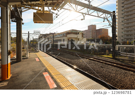Empty Urban Train Station Platform with Tracks in Bright Nishi Tachikawa Dec 4 2024 123698781