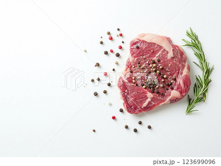 Raw fresh red ribeye steak on with rosemary and peppercorns on white kitchen.Macro.AI Generative. 123699096