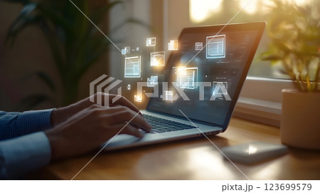 person working on laptop with digital data overlay person working on laptop with digital data overlay 123699579