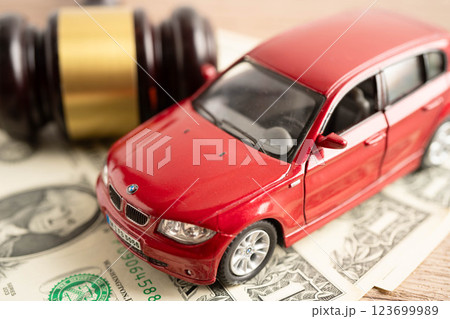 Bangkok, Thailand November 18, 2023 Car on banknote money, buying or insurance concept. 123699989