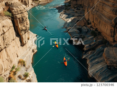 People enjoying kayaking on narrow river in rocky mountains area on sunny summer day during vacation holiday trip.Drone view.AI Generative. People enjoying kayaking on narrow river in rocky mountains area on sunny summer day during vacation holiday trip.Drone view.AI Generative. 123700346