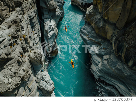 Group of kayaking on narrow river between rocky mountains on sunny summer day.AI Generative. Group of kayaking on narrow river between rocky mountains on sunny summer day.AI Generative. 123700377