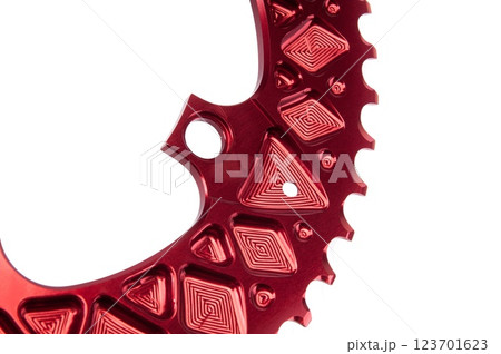 Close up of a red oval bicycle chainring against white isolated background. Professional bicycle part. 123701623