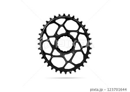 Black oval bicycle chainring against white isolated background, floating above the surface. Professional bicycle part. 123701644