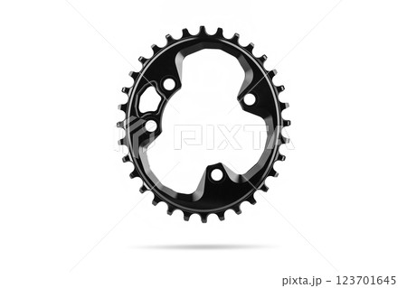 Black oval bicycle chainring against white isolated background, floating above the surface. Professional bicycle part. 123701645