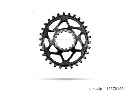 Black oval bicycle chainring against white isolated background, floating above the surface. Professional bicycle part. 123701654