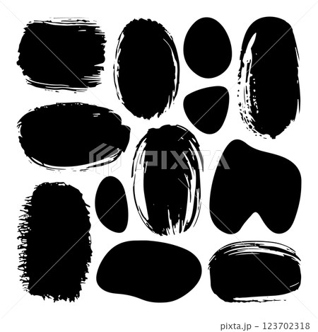 A collection of black ink brush strokes with a rough texture and organic forms. Perfect for backgrounds, digital art, and modern design. 123702318