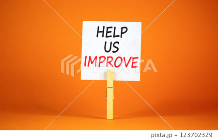 Help us improve symbol. Concept words Help us improve on beautiful white paper on clothespin. Beautiful orange background. Business motivational help us improve concept. Copy space. Help us improve symbol. Concept words Help us improve on beautiful white paper on clothespin. Beautiful orange background. Business motivational help us improve concept. Copy space. 123702329