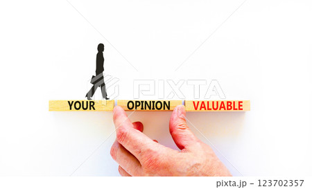 Your opinion valuable symbol. Concept words Your opinion valuable on beautiful wooden blocks. Beautiful white background. Businesswoman icon. Business your opinion valuable concept. Copy space. 123702357