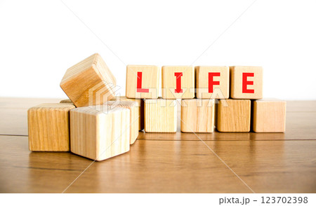 Life symbol. Concept word Life on beautiful wooden blocks. Beautiful wooden table white background. Business, lifestyle, support and life concept. Copy space. 123702398