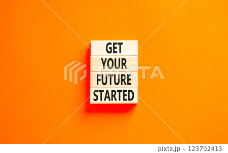 Get your future started symbol. Concept words Get your future started on beautiful wooden blocks. Beautiful orange table orange background. Business get your future started concept. Copy space. Get your future started symbol. Concept words Get your future started on beautiful wooden blocks. Beautiful orange table orange background. Business get your future started concept. Copy space. 123702413
