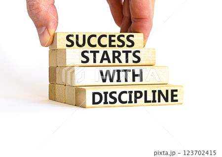 Success starts with discipline symbol. Concept words Success starts with discipline on beautiful wooden blocks. Beautiful white background. Business success starts with discipline concept. Copy space 123702415