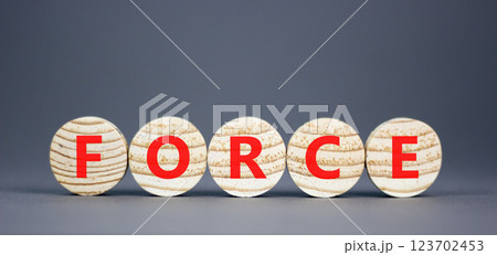 Force symbol. Concept word Force on beautiful wooden circles. Beautiful grey table grey background. Business lifestyle force concept. Copy space. Force symbol. Concept word Force on beautiful wooden circles. Beautiful grey table grey background. Business lifestyle force concept. Copy space. 123702453