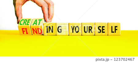Finding or creating yourself symbol. Concept words Finding yourself or Creating yourself on beautiful wooden blocks. Beautiful white background. Business creating yourself concept. Copy space. 123702467