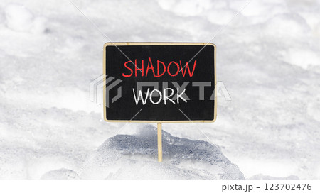 Shadow work psychology symbol. Concept words Shadow work on beautiful black chalk blackboard. Beautiful white snow background. Psychology shadow work concept. Copy space. Shadow work psychology symbol. Concept words Shadow work on beautiful black chalk blackboard. Beautiful white snow background. Psychology shadow work concept. Copy space. 123702476