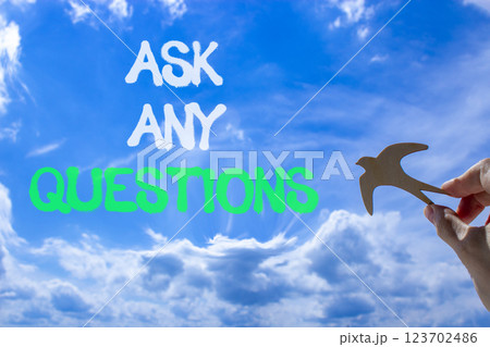 Ask any questions symbol. Concept words Ask any questions on beautiful blue sky. Beautiful blue sky and clouds background. Businessman hand. Wooden bird. Business ask any questions concept. Copy space Ask any questions symbol. Concept words Ask any questions on beautiful blue sky. Beautiful blue sky and clouds background. Businessman hand. Wooden bird. Business ask any questions concept. Copy space 123702486