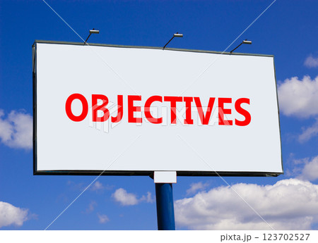 Objectives symbol. Concept word Objectives on beautiful big white road sign. Beautiful blue sky and clouds background. Business objectives concept. Copy space. Objectives symbol. Concept word Objectives on beautiful big white road sign. Beautiful blue sky and clouds background. Business objectives concept. Copy space. 123702527
