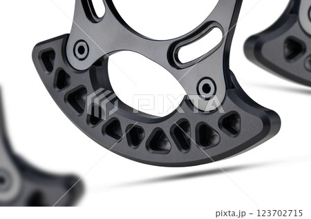 Taco Bashguard bicycle part designed for bicycle  chainrings isolated on white background floating above the ground. 123702715