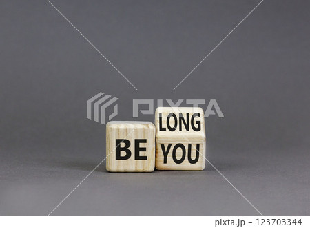 Belonging and belong symbol. Concept words Be you Belong on beautiful wooden block. Beautiful grey table grey background. Business motivational belonging and belong concept. Copy space. 123703344