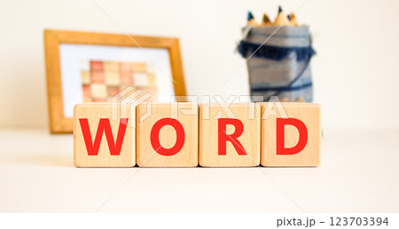 Word symbol. Concept word Word on beautiful wooden blocks. Beautiful picture frame and colored pencils. Beautiful white table white background. Business, lifestyle, support word concept. Copy space. 123703394