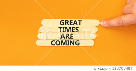 Great times are coming symbol. Concept words Great times are coming on beautiful wooden sticks. Beautiful orange table orange background. Business great times are coming concept. Copy space. Great times are coming symbol. Concept words Great times are coming on beautiful wooden sticks. Beautiful orange table orange background. Business great times are coming concept. Copy space. 123703497