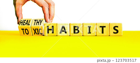 Healthy or toxic habits symbol. Concept words Healthy habits or Toxic habits on beautiful wooden blocks. Beautiful yellow table white background. Business healthy or toxic habits concept. Copy space. Healthy or toxic habits symbol. Concept words Healthy habits or Toxic habits on beautiful wooden blocks. Beautiful yellow table white background. Business healthy or toxic habits concept. Copy space. 123703517