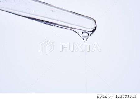 Pipette with delicate blue serum close-up. 123703613