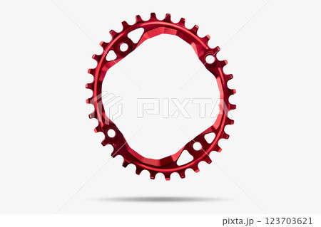 Red oval bicycle chainring against white isolated background, floating above the surface. Professional bicycle part. 123703621