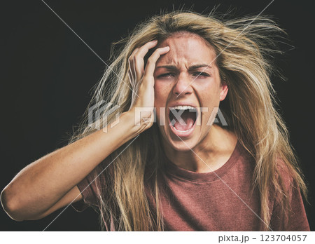 Face, mental health and screaming woman headache, anxiety or stress. Psychology, bipolar or crazy, insane or depressed schizophrenia female, shouting or hearing voices alone on dark studio background Face, mental health and screaming woman headache, anxiety or stress. Psychology, bipolar or crazy, insane or depressed schizophrenia female, shouting or hearing voices alone on dark studio background 123704057