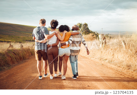 Hug, friends and walking with back view in countryside for group holiday bonding moment together. Support, care and love in friendship with people enjoying South Africa dirt road walk on vacation. Hug, friends and walking with back view in countryside for group holiday bonding moment together. Support, care and love in friendship with people enjoying South Africa dirt road walk on vacation. 123704135