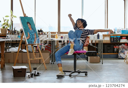 Art, happy and excited woman with painting in studio or design school smiling at finished creative project. Student from India, painter girl and celebration of completed canvas in classroom on chair. Art, happy and excited woman with painting in studio or design school smiling at finished creative project. Student from India, painter girl and celebration of completed canvas in classroom on chair. 123704274