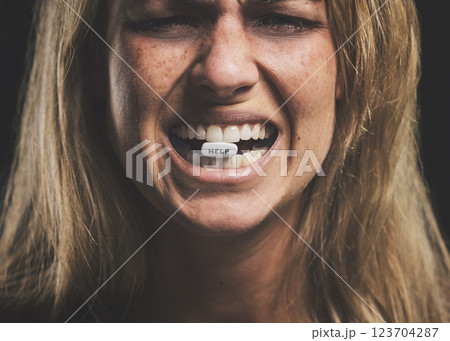 Pills, sad and addiction woman with drug, mental health and overdose wanting help. Depression, pill and sick female suffering from pain, fear or danger with overdose of prescription drugs or medicine 123704287