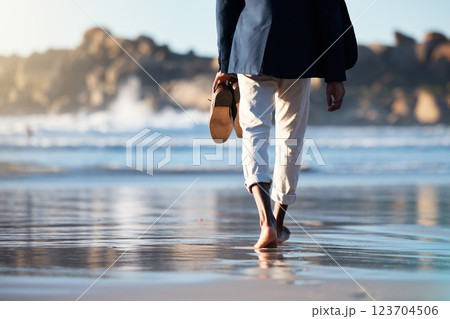 Relax, beach and man walking with shoes in hand for peace, travel and wellness on vacation. Health, travel or summer with feet of guy step in the sand for calm, nature and lifestyle on Brazil holiday Relax, beach and man walking with shoes in hand for peace, travel and wellness on vacation. Health, travel or summer with feet of guy step in the sand for calm, nature and lifestyle on Brazil holiday 123704506
