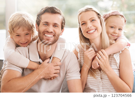 Happy family, father and mother portrait with children relaxing, hugging and enjoying fun quality time at home. Smile, mom and dad love bonding with young kids or boy and girl siblings affection 123704566