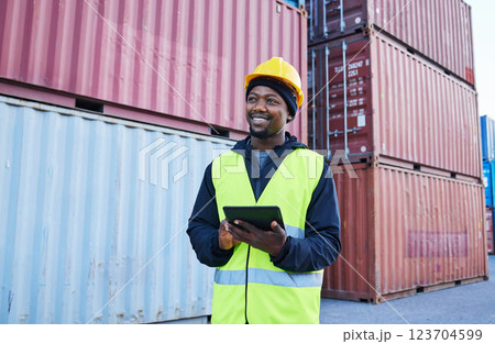 Tablet, logistics and shipping with a supply chain black man manager working on a commercial container dock outside. Internet, freight and cargo with a male courier at work in an export storage yard 123704599