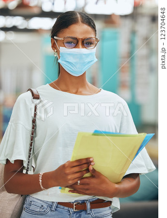 College student, woman and covid face mask for university, education and learning. Portrait of young campus female safety in corona virus pandemic, flu bacteria or health safety while studying school College student, woman and covid face mask for university, education and learning. Portrait of young campus female safety in corona virus pandemic, flu bacteria or health safety while studying school 123704648