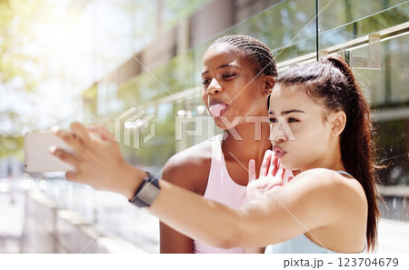 Funny selfie, fitness and friends training in city of Canada while live streaming on social media with phone. Influencer athlete women with comic face for photo and video blog on web during workout 123704679