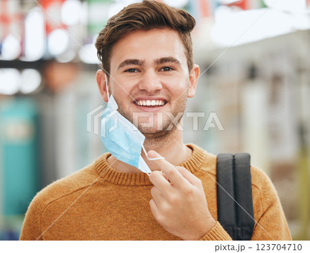 Freedom, covid and man take off mask at college or university. Health, safety and compliance for covid 19 virus rules with student in Canada happy, cheerful or excited with end of corona pandemic. Freedom, covid and man take off mask at college or university. Health, safety and compliance for covid 19 virus rules with student in Canada happy, cheerful or excited with end of corona pandemic. 123704710