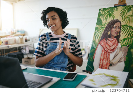 Video conference, presentation and painter talking about her painting on call with a computer in her work studio. Indian artist, designer and painter speaking about creative paint canvas on a webinar Video conference, presentation and painter talking about her painting on call with a computer in her work studio. Indian artist, designer and painter speaking about creative paint canvas on a webinar 123704711