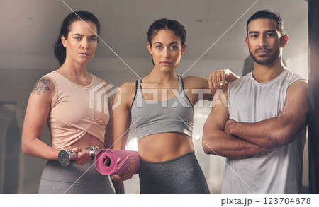 Portrait, fitness and group of friends at gym for challenge, health or bodybuilder with exercise mat. Confidence, team or people at club for sport, dumbbell training or arms crossed for determination Portrait, fitness and group of friends at gym for challenge, health or bodybuilder with exercise mat. Confidence, team or people at club for sport, dumbbell training or arms crossed for determination 123704878
