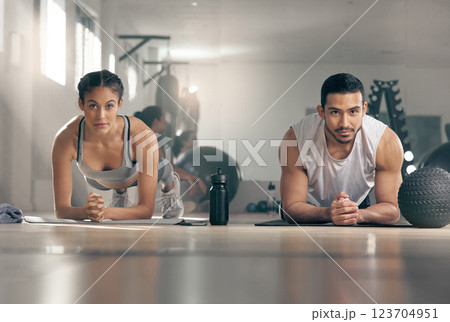 Fitness, plank and portrait of couple in gym together for bonding, training or workout. Balance, core or exercise with man and woman athlete in health club for challenge or performance routine 123704951