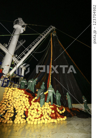 Image of a large fishing vessel retrieving its nets. Image of a large fishing vessel retrieving its nets. 123704982