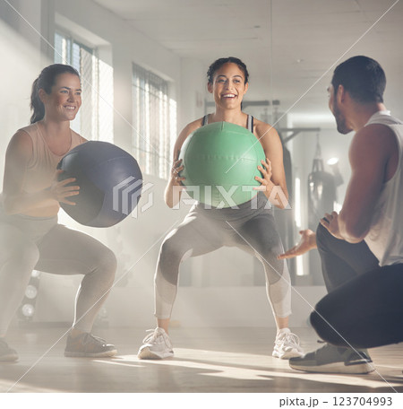 Personal trainer, balance and women with exercise ball, fitness and training for core strength in gym. Happy, instructor and workout for people in health club, wellness and equipment for muscles Personal trainer, balance and women with exercise ball, fitness and training for core strength in gym. Happy, instructor and workout for people in health club, wellness and equipment for muscles 123704993