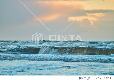 Sunset over north sea waves 123705364