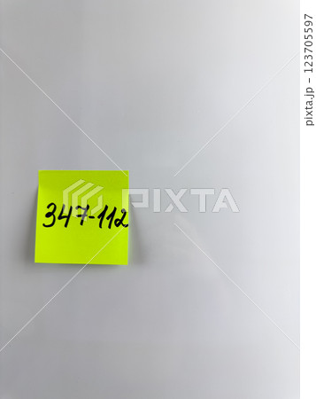 Reminder on refrigerator with the phone number of person Reminder on refrigerator with the phone number of person 123705597