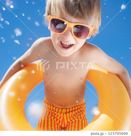Happy child playing in waterpark. Kid having fun on summer vacation Happy child playing in waterpark. Kid having fun on summer vacation 123705699