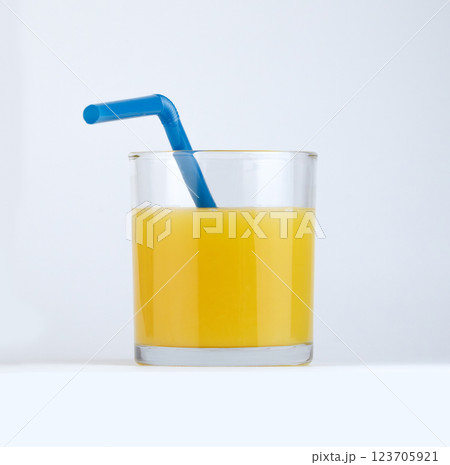 Freshly squeezed orange juice in a clear glass. High quality photo 123705921