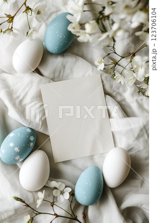 Light blue painted easter eggs on white background with copy space 123706104