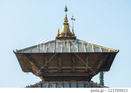 A bunk roof and a golden spire on main temple of Pashupatinath in Kathmandu, Nepal. This temple is a Hindu temple dedicated to Pashupati, a form of Shiva. A bunk roof and a golden spire on main temple of Pashupatinath in Kathmandu, Nepal. This temple is a Hindu temple dedicated to Pashupati, a form of Shiva. 123709923