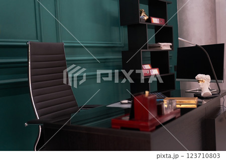 High-tech and luxurious office of the director of the company. which has a modern wooden table and an armchair. High quality photo High-tech and luxurious office of the director of the company. which has a modern wooden table and an armchair. High quality photo 123710803